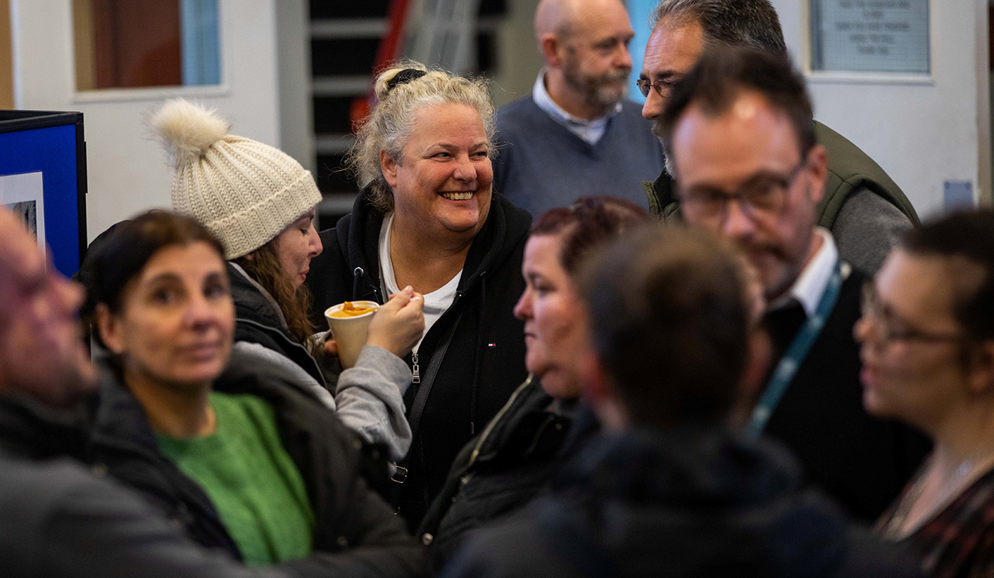 A small crowd of people at a consultation event